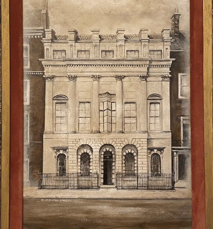 A black and white oil painting in a wooden frame depicting the original Palladian Mansion at 17 Bruton Street, birthplace of Queen Elizabeth II.